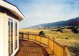 The deck has 1,040 square feet and is made of redwood, which Paul and Sherri are going to leave untreated, in keeping with their desire never to paint eaves or railings again.